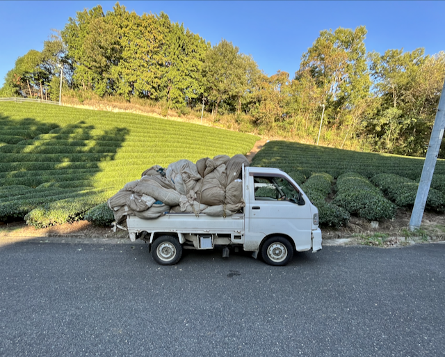 A Keitora, a small Japanese truck, half loaded with the last harvest of the day.